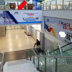 Lintel Billboard Above Escalator Facing Traffic Descending From Departure Hall, Lagos